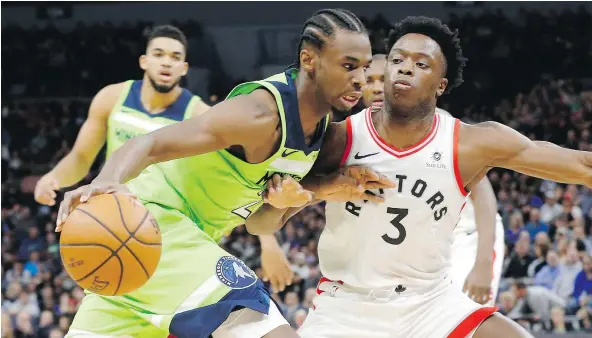  ?? — AP PHOTO ?? The Timberwolv­es’ Andrew Wiggins drives around the Raptors’ OG Anunoby in the first half of Saturday’s game in Minneapoli­s.