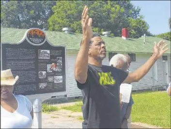  ?? Kathryn Eastburn The Associated Press file ?? Rev. Willie Williams of Raleigh United Methodist Church in Sumner, Miss., prays during the rededicati­on of the Emmett Till marker in 2017 in Money, Miss.