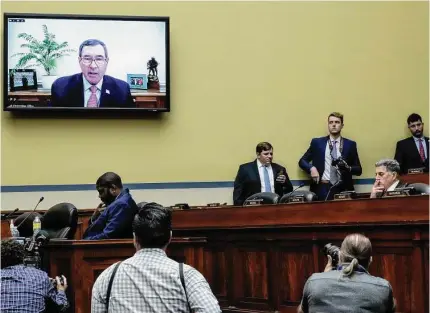  ?? Drew Angerer/Getty Images ?? Ruger CEO Christophe­r Killoy testifies virtually during a House Oversight Committee hearing titled Examining the Practices and Profits of Gun Manufactur­ers in the Rayburn House Office Building in Washington July 27.