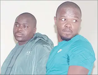  ?? (Pics: Sibusiso Zwane) ?? Siyabonga Gezani Ndimande (Nxele) and Malusi Dave Ndimande (Mjay), who were arrested in the country in connection with the murder of Kiernan Forbes, popularly known as ‘AKA’ and his friend Tebello ‘Tibz’ Motsoane, talking to HMCS officers after their case was postponed to March 20, 2024.
