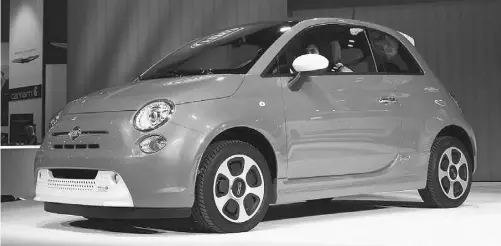  ?? Kevork Djansezian/getty Images ?? Chrysler unveiled the Fiat 500e electric car Nov. 28 at the Los Angeles Auto Show’s media preview day.
