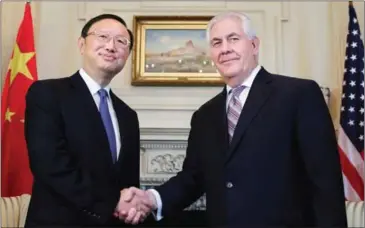  ??  ?? US Secretary of State Rex Tillerson (right) shakes hands with Chinese State Councilor Yang Jiechi, before their meeting at the State Department in Washington last month.