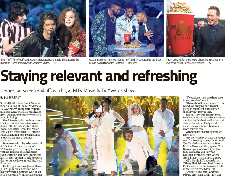  ??  ?? (From left) Finn Wolfhard, Gaten Matarazzo and Sadie Sink accept the award for Best TV Show for Stranger Things .—AP Actors Boseman (centre), Duke (left) and Jordan accept the Best Movie award for Black Panther. — Reuters Haddish (centre) performs a...