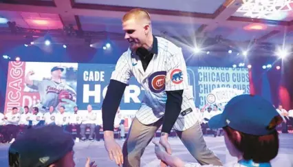  ?? CHRIS SWEDA/CHICAGO TRIBUNE ?? Pitcher Cade Horton is introduced during the opening ceremony of the Cubs Convention on Jan. 12 at the Sheraton Grand Chicago.