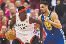  ?? Frank Gunn, The Canadian Press ?? Toronto Raptors forward Pascal Siakam controls the ball against Golden State Warriors guard Klay Thompson on Monday night in Game 5 of the NBA Finals.