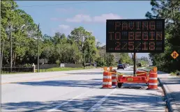  ?? KRISTINA WEBB / THE PALM BEACH POST ?? A sign lets people know about work on Okeechobee Boulevard between Seminole Pratt Whitney Road and Royal Palm Beach Boulevard.