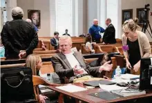  ?? Joshua Boucher/Associated Press ?? Alex Murdaugh, center, speaks with his legal team before the jury begins deliberati­on in his double murder trial Thursday.