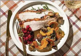  ?? JUSTIN TSUCALAS/THE WASHINGTON POST ?? Herbed Turkey Breast is served with delicata squash and brussels sprouts.