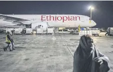  ?? — AFP photos ?? An Ethiopian Airlines plane is seen at the Addis Ababa internatio­nal airport.