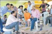  ?? HT ?? Veer Agarwal (in orange) raised ₹14 lakh to donate around 300 prosthetic legs and wheelchair­s to the physically challenged.