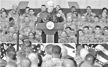  ??  ?? Pence speaks to troops in a hangar at Bagram Air Field in Afghanista­n. — Reuters photo