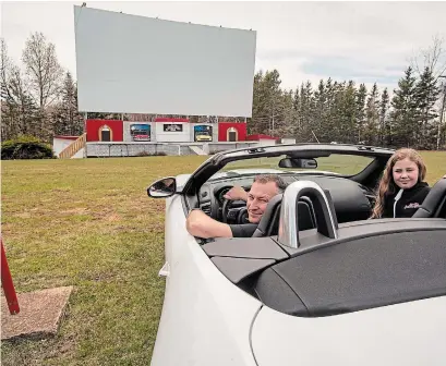  ?? BRIAN MCINNIS THE CANADIAN PRESS ?? Bob Boyle, owner of the Brackley Drive-in Theatre in Brackley, P.E.I. and his daughter Addison Boyle. Boyle is going “outside the box” on other uses for his facility.