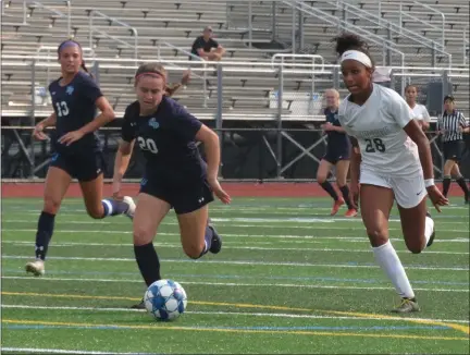  ?? MIKE CABREY — MEDIANEWS GROUP ?? Pennridge’s Leah Malone (28) and North Penn’s Jamie Webb (20) tries to get to the ball during their game Tuesday.