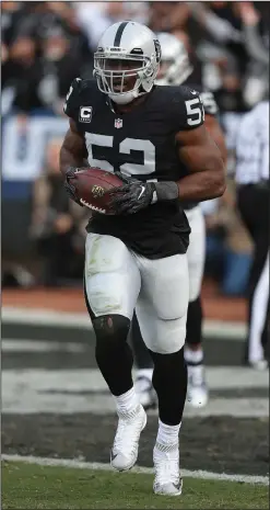  ?? AP PHOTO ?? Oakland Raiders linebacker Khalil Mack celebrates an intercepti­on return for a touchdown against the Carolina Panthers.