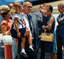  ?? Courtesy Tracy Cernan Woolie ?? Gene Cernan holds daughter Tracy after returning from his Gemini 9 mission in 1966. Cernan went into space three times.