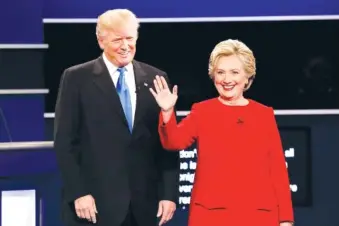  ?? ASSOCIATED PRESS FILE PHOTO ?? Then-Republican presidenti­al nominee Donald Trump and then-Democratic presidenti­al nominee Hillary Clinton are introduced during a presidenti­al debate in September 2016 at Hofstra University in Hempstead, N.Y.