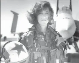  ?? Thomas P. Milne ?? U.S. Navy Lt. Tammie Jo Shults, one of the first women to fly Navy tactical aircraft, poses in front of an F/A-18A with Tactical Electronic­s Warfare Squadron 34 in 1992. She was the pilot of the Southwest plane that made an emergency landing Tuesday.