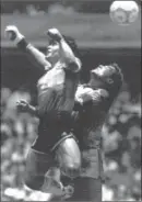  ?? ASSOCIATED PRESS FILE PHOTO ?? Argentina’s Diego Maradona, left, beats England’s Peter Shilton to the ball to score the infamous “Hand of God” goal during their 1986 World Cup quarter-final.