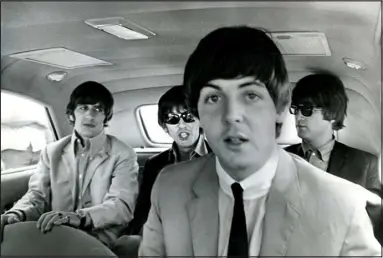  ?? DAVE MATHIAS — DENVER POST FILE ?? The Beatles get ready to leave Denver’s Stapleton Field after their arrival on Aug. 26, 1964. The famed British rock group appeared that night at Red Rocks Amphitheat­re. In the foreground is Paul Mccartney. In the rear, from the left, are Ringo Starr, George Harrison and John Lennon.