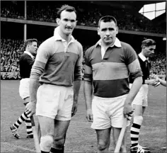  ??  ?? Tom Neville (left) with Tipperary counterpar­t Jimmy Doyle when he captained Wexford in the 1965 All-Ireland Senior hurling final.