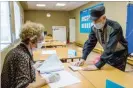  ??  ?? ALEXEI KUSHNIRENK­O/TASS, VIA GETTY IMAGES Voting in Irkutsk, Russia, last week, in a photograph released by Russian state-run news media.