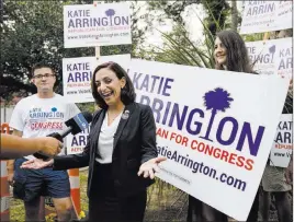  ?? Kathryn Ziesig ?? The Associated Press Republican state Rep. Katie Arrington, who is seeking the congressio­nal seat held by Mark Sanford, campaigns after voting for herself in the South Carolina primary election on Tuesday at Bethany United Methodist Church in...