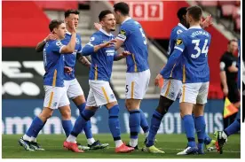  ??  ?? Brighton players celebrate scoring their second goal against Southampto­n at the weekend as they overtook Newcastle in the table