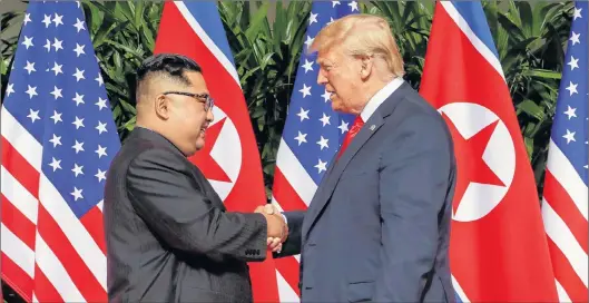  ?? AP PHOTO ?? North Korean Leader Kim Jong-un shakes hands with U.S. President Donald Trump at their summit in Singapore earlier this week.