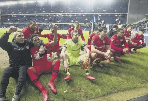  ??  ?? 0 Bayer Leverkusen players celebrate their 3-1 win over Rangers in the first leg of the Europa League last-16 tie at Ibrox.