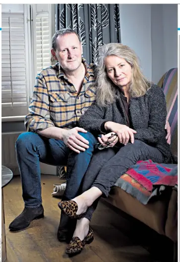  ??  ?? Tired and emotional: Richard Powell, with wife Mary, has a tumour lodged in a part of the brain that affects your emotions