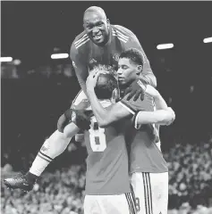  ??  ?? Manchester United’s Marcus Rashford (right) celebrates with teammates after scoring against CSKA Moscow. — Reuters photo