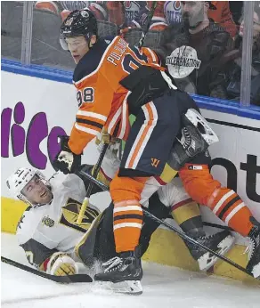  ?? ED KAISER ?? Edmonton Oilers Jesse Puljujarvi takes down Vegas Golden Knights Brad Hunt Tuesday night in Edmonton.