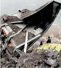  ?? PTI ?? Rescue operations underway at the coal mine, where several workers are trapped in Godda, on Friday. —