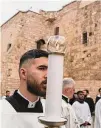  ?? Mahmoud Illean/Associated Press ?? Catholic clergy walk in procession next to the Church of the Nativity, Sunday.