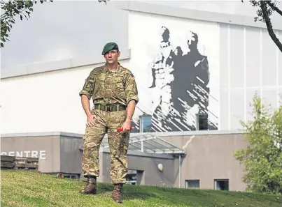  ??  ?? Marine David Griffin with his work at the 45 Commando base at Condor, near Arbroath.