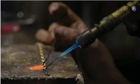  ?? Photograph: Izzy Sasada ?? A jeweller in Puerto Maldonado, capital of the Madre de Dios region, works with illegally sourced gold.