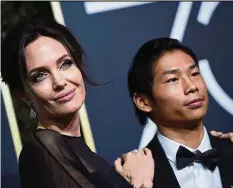  ??  ?? Angelina Jolie arrives with her son Pax. Her film First They Killed My Father is a nominee in the Best Foreign Language Film category. In The Fade wins the award. — AFP