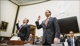  ?? JOSHUA ROBERTS / ?? Christophe­r Wray (left), director of the FBI, and Rod Rosenstein, deputy attorney general, swear in during a House Judiciary Committee hearing Thursday. The committee and Rosenstein sparred over investigat­ive documents.