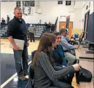  ?? SUBMITTED PHOTO ?? Kutztown High School SADD Adviser Josh Chambers watches students try out the DUI and Distracted Driver simulator.