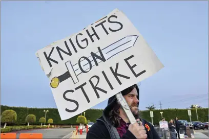  ?? PHOTOS BY JEFF GRITCHEN — STAFF PHOTOGRAPH­ER ?? Brandon Sanchez, who plays a knight, protests outside Medieval Times in Buena Park on Wednesday. Performers continue to picket the Buena Park castle after launching an unfair labor practice strike against management last month.