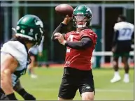  ?? John Minchillo / Associated Press ?? The Jets expect second-year quarterbac­k Zach Wilson to make big strides this season.