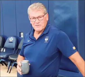  ?? Paul Doyle / Hearst Connecticu­t Media ?? UConn coach Geno Auriemma on the court at the Werth Family Champions Center for the first day of practice Friday.