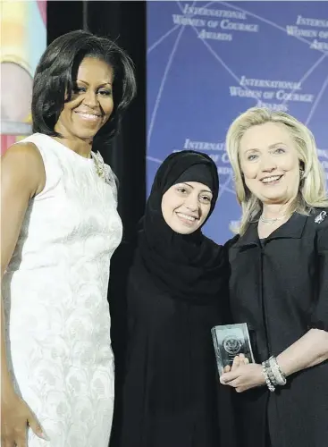  ?? STATE DEPARTMENT FILES ?? Then-U.S. Secretary of State Hillary Rodham Clinton and first lady Michelle Obama with Internatio­nal Women of Courage Award winner Samar Badawi of Saudi Arabia, in Washington, D.C, in 2012. Badawi was detained earlier this week in Saudi Arabia.