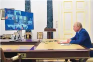  ?? ALEXEI DRUZHININ, SPUTNIK, KREMLIN POOL/AP ?? Russian President Vladimir Putin chairs a Security Council meeting via video conference in Moscow, Russia Friday.