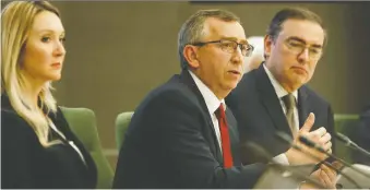  ?? IAN KUCERAK FILES ?? Dale Macmaster, centre, AIMCO chief investment officer, says Alberta's public pension manager is tilting from Alberta investment­s to focus more on logistics, data and health centres.
