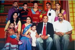  ??  ?? Happy family: A family portrait of Permal (seated, second right) with wife Tevaki (seated, second left) during their daughter Amutha’s graduation.