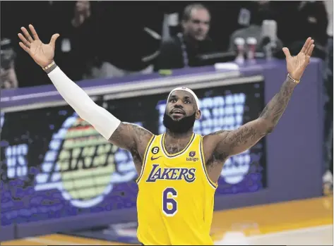  ?? MARK J. TERRILL/AP ?? LOS ANGELES LAKERS FORWARD LEBRON JAMES celebrates after scoring to pass Kareem Abdul-jabbar to become the all-time leading scorer during the second half of a game against the Oklahoma City Thunder on Tuesday in Los Angeles.