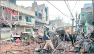  ?? AFP ?? A security personnel patrols near burnt-out and damaged areas during the riots in New Delhi on February 26, 2020.