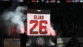  ?? ASSOCIATED PRESS ?? The jersey of former Albany River Rat Patrik Elias, of the Czech Republic, is raised to the ceiling as the New Jersey Devils retired his number before an NHL hockey game against the New York Islanders Saturday in Newark, N.J.