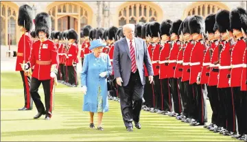  ??  ?? Trump and Britain’s Queen Elizabeth inspect the Coldstream Guards during a visit to Windsor Castle in Windsor, Britain. — Reuters photo